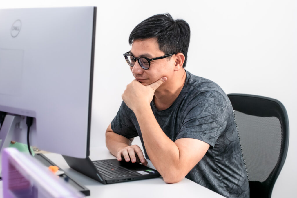 Alumnus Yitch at his desk
